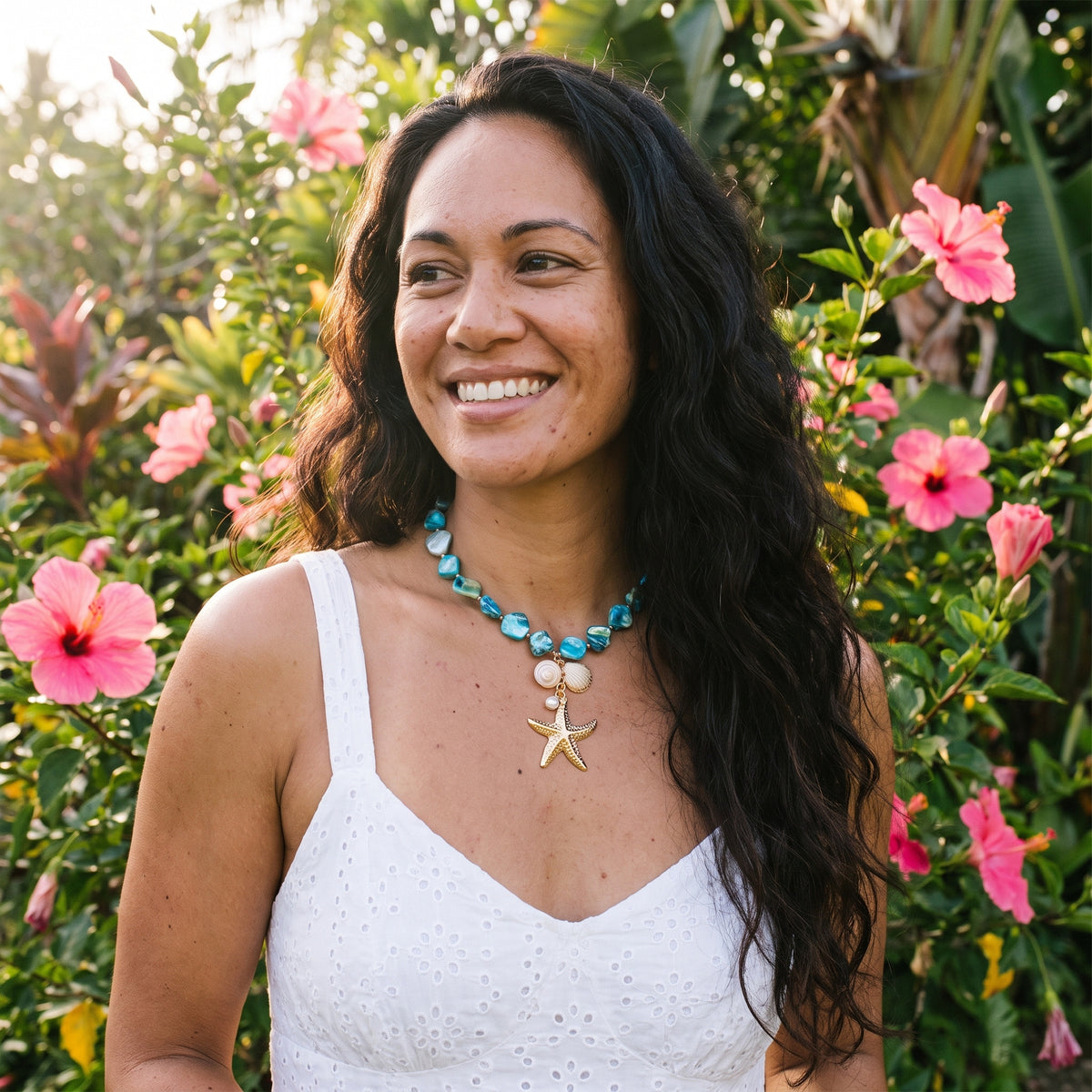 Smiling woman wearing the Ariel Lagoon Treasure necklace