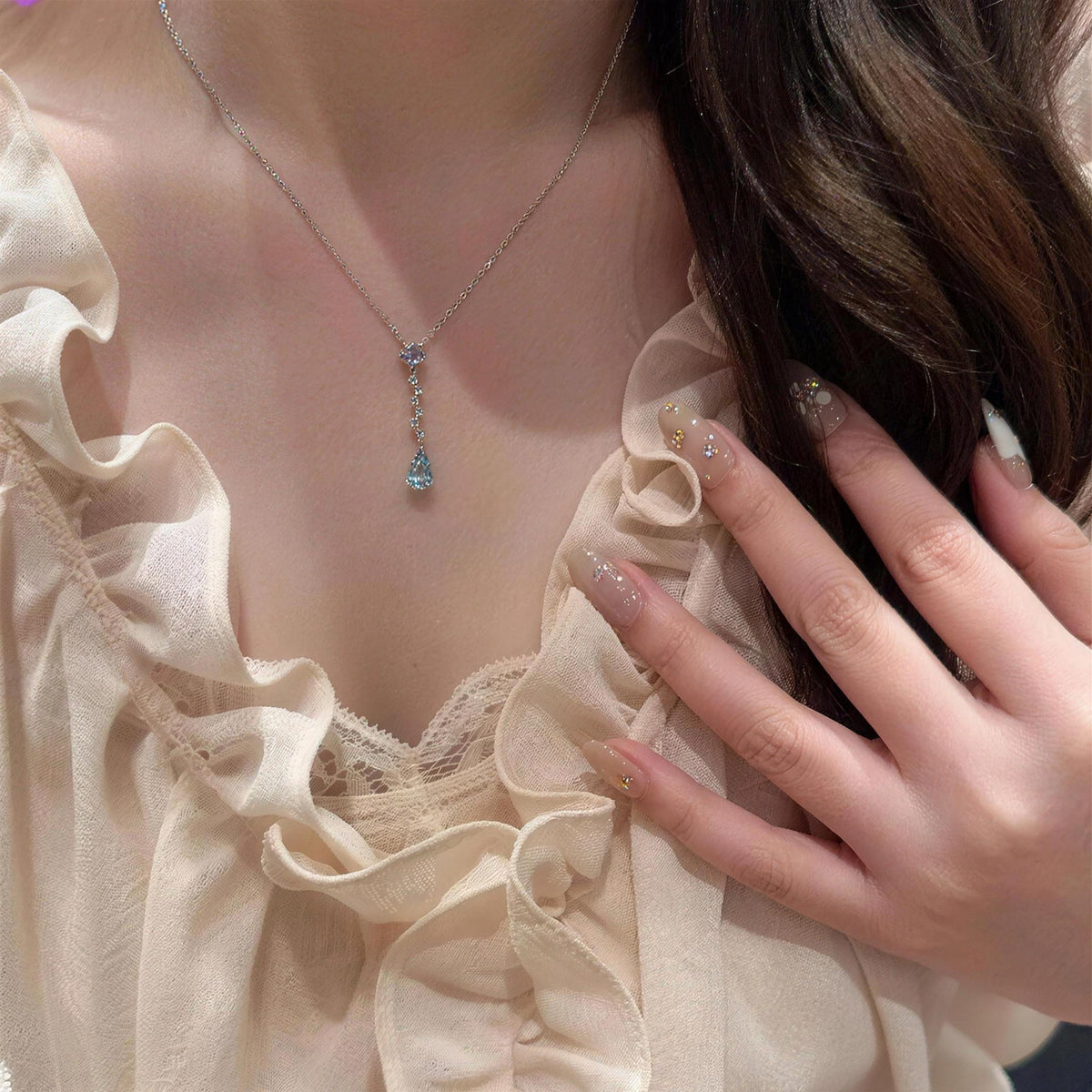 The Ocean Tear necklace shown at its true size
