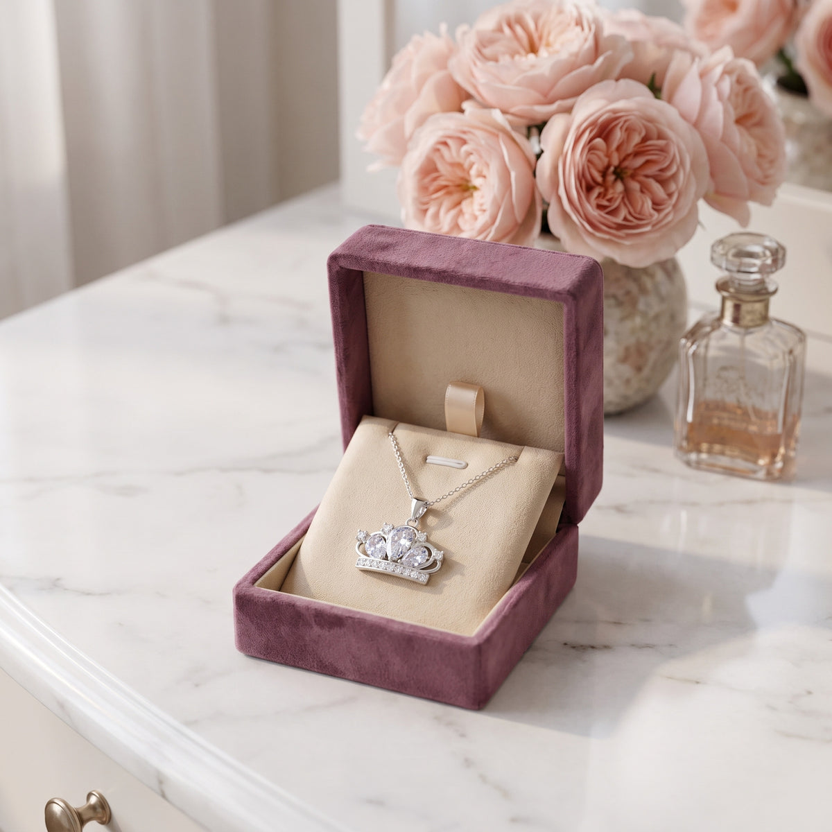 The Crystal Crown necklace in the Storyelle plum velvet gift box