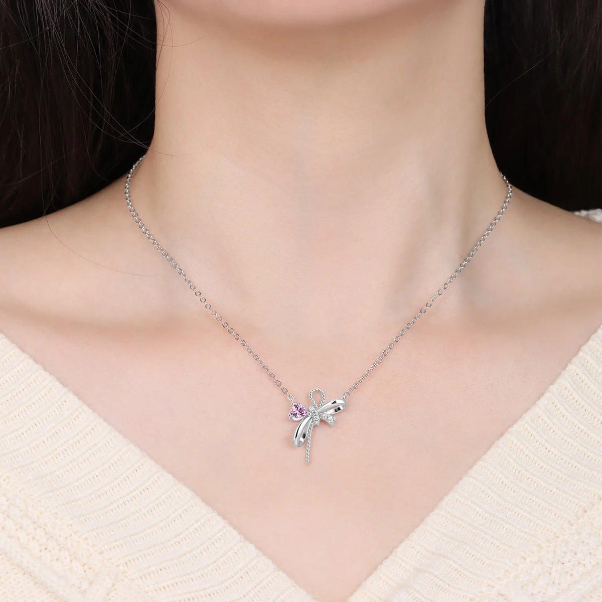 The Pink Bow necklace shown at its true size
