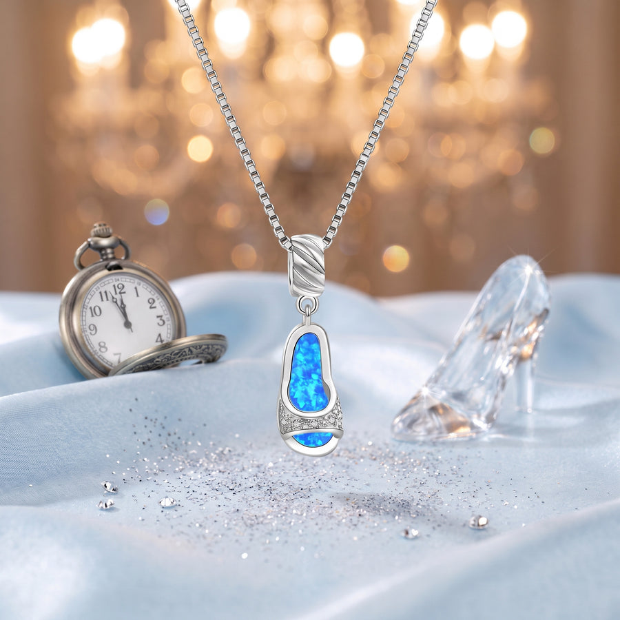 The “Cinderella” Midnight Opal Necklace on ice-blue satin with a glass slipper and a pocket watch