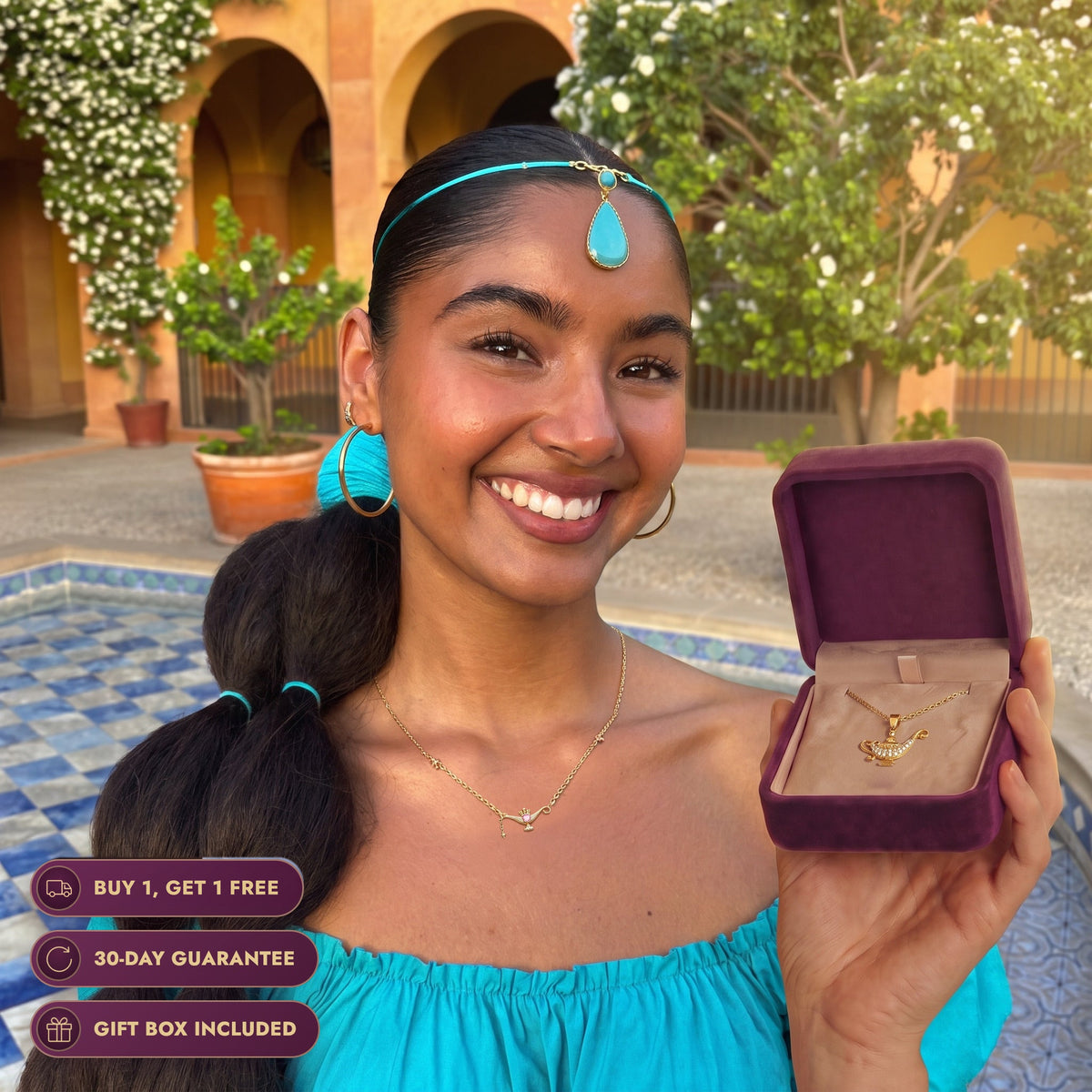 Real life Jasmine at her palace, holding the Storyelle gift box and wearing the Wish Lamp necklace, buy 1 get 1 free, 30-day guarantee, gift box included
