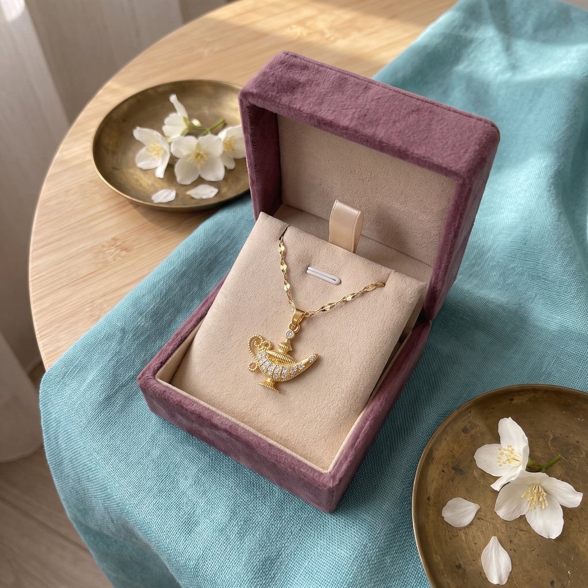 The Starlight Lamp necklace in the Storyelle plum velvet gift box