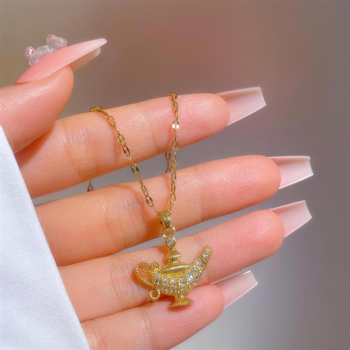 The Starlight Lamp necklace shown at its true size